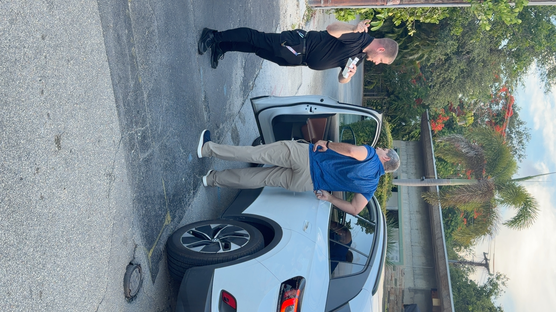 Attendant welcoming a guest curbside